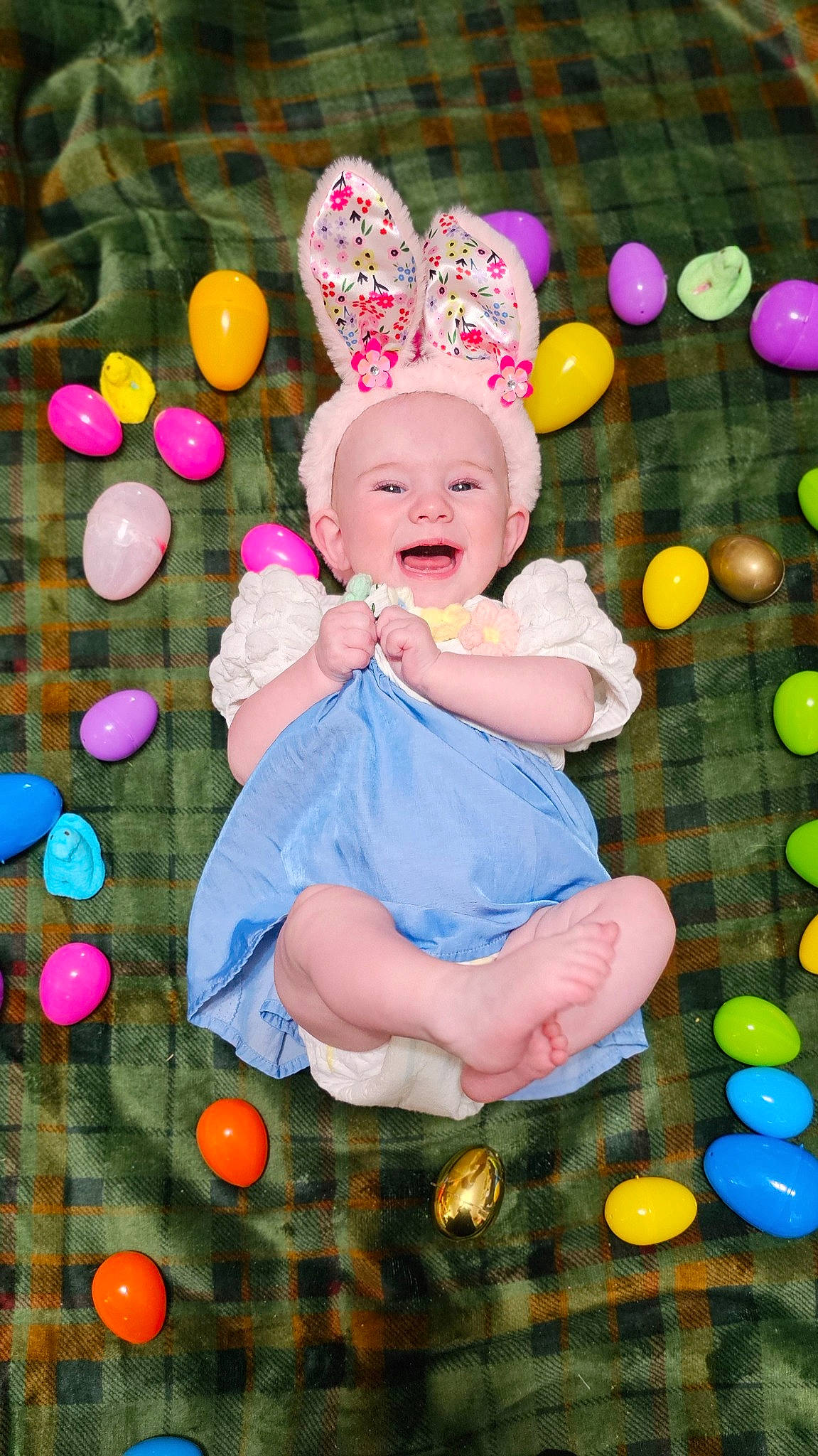 Madelyn is registered to the contest to win money with this photo: baby, baby_toddler_clothing, beauty, child, event, facial_expression, fun, grass, green, happy, holiday, leisure, magenta, party_supply, pattern, people_in_nature, person, pink, play, sitting