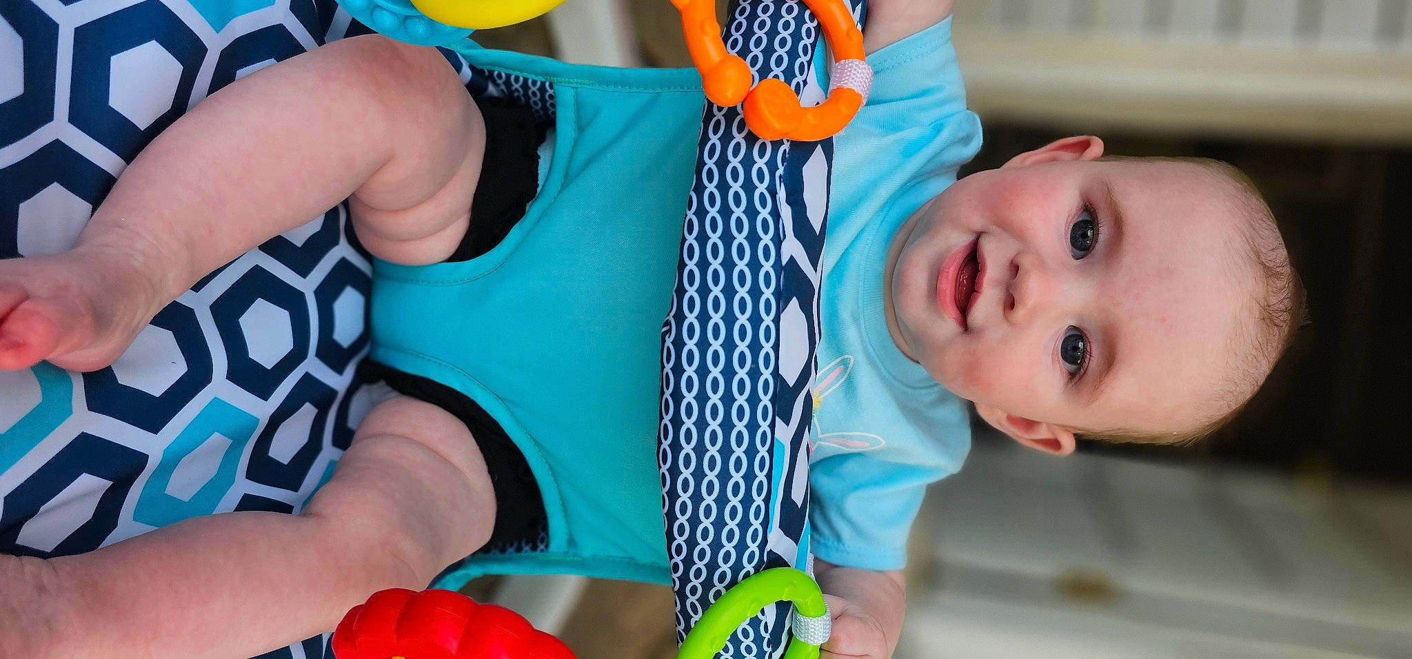 Madelyn joined the competition — help win amazing prizes! azure, baby, baby_toddler_clothing, blue, chest, child, electric_blue, finger, fun, green, happy, joy, leisure, mouth, pattern, person, personal_protective_equipment, product, textile, thigh