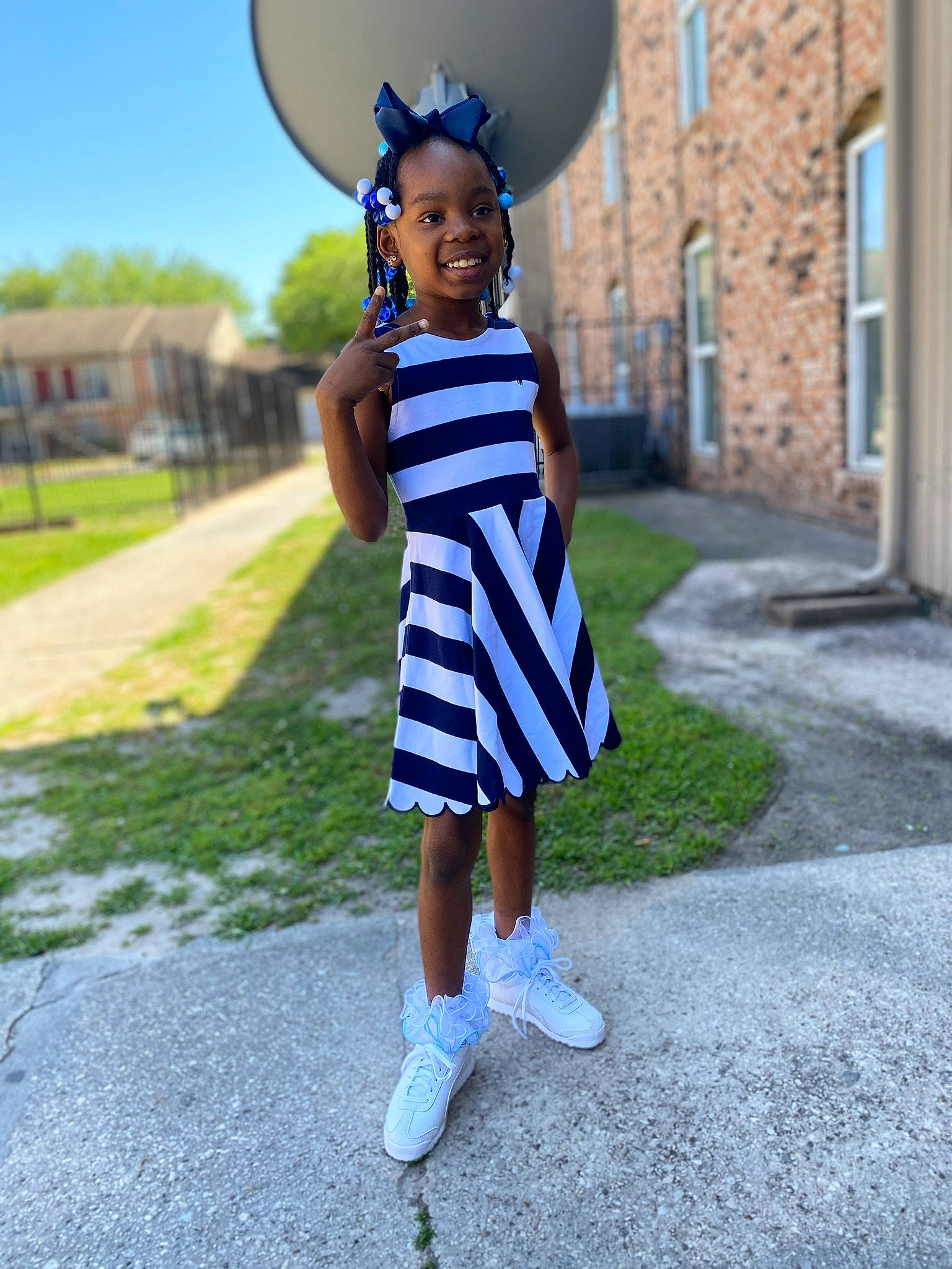 Patience joined the competition — help win amazing prizes! asphalt, azure, balloon, beauty, clothing, cool, day_dress, electric_blue, gesture, grass, happy, joy, person, recreation, sleeve, standing, street_fashion, sun_hat, t_shirt, toddler