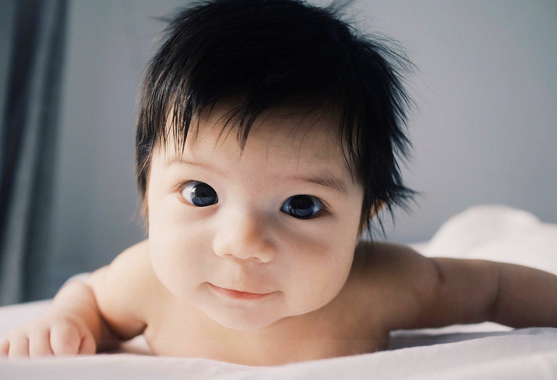 Dexter is registered to the contest to win money with this photo: baby, beauty, cheek, child, chin, ear, eye, eyebrow, eyelash, flash_photography, happy, iris, lip, mouth, no_expression, nose, person, skin, smile, thumb