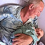 Eden joined the competition — help win amazing prizes! elderly_man, baby, newborn, blanket, couch, holding, love, tenderness, family, indoor, portrait, watch, ring, clothing, relaxation, comfort, peaceful, skin, head, hand
