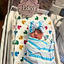 Eden is registered to the contest to win money with this photo: newborn, baby, sleeping, swaddled, hospital, bassinet, blanket, headband, bow, infant, cute, peaceful, colorful, duck_pattern, nameplate, wooden, soft, resting, child, portrait