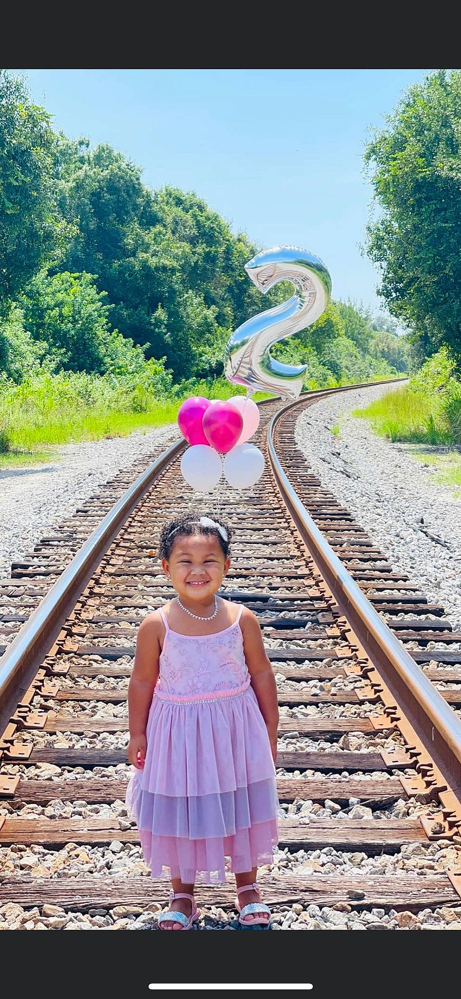Kelani joined the competition — help win amazing prizes! blue, green, happy, human_body, joy, leaf, leisure, line, mode_of_transport, nature, people_in_nature, person, photograph, pink, plant, rolling, sky, smile, track, travel