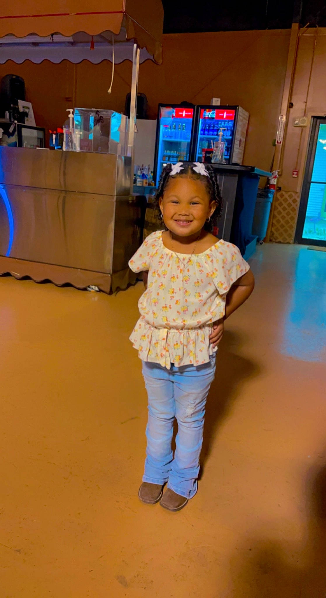 Kelani is registered to the contest to win money with this photo: baby_toddler_clothing, blue, child, electric_blue, entertainment, event, floor, flooring, fun, happy, joy, leisure, person, recreation, shipping_box, skin, smile, standing, t_shirt, television