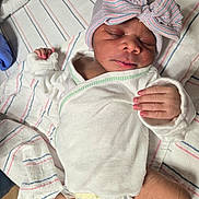 Sarai joined the competition — help win amazing prizes! baby, blanket, bow, child, cute, diaper, face, hand, hat, hospital, infant, lying, newborn, onesie, peaceful, portrait, resting, skin, sleeping, soft