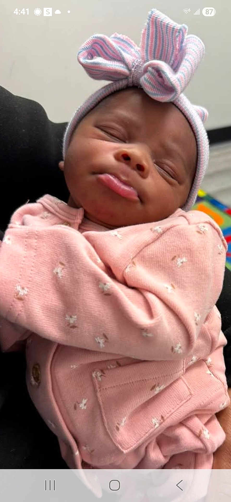 Sarai is registered to the contest to win money with this photo: adorable, baby, bow, child, closeup, cute, hat, headwear, human, indoors, infant, newborn, peaceful, pink_clothing, portrait, pout, resting, sleeping, soft_fabric, wearing