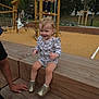 toddler, child, playground, wood, bench, outdoor, clothing, shoes, smile, person, play, fun, park, wooden_structure, trees, daylight, happy, casual, young_child, activity