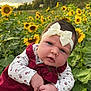 Amirah is registered to the contest to win money with this photo: baby, child, flower, sunflower, field, nature, outdoor, headband, dress, greenery, portrait, person, flora, plant, hand, face, sky, cute, infant, growth