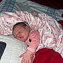 Amirah is registered to the contest to win money with this photo: baby, sleeping, blanket, pink, pillow, bed, hand, infant, child, rest, cozy, soft, clothing, pattern, comfort, peaceful, indoor, cute, face, person