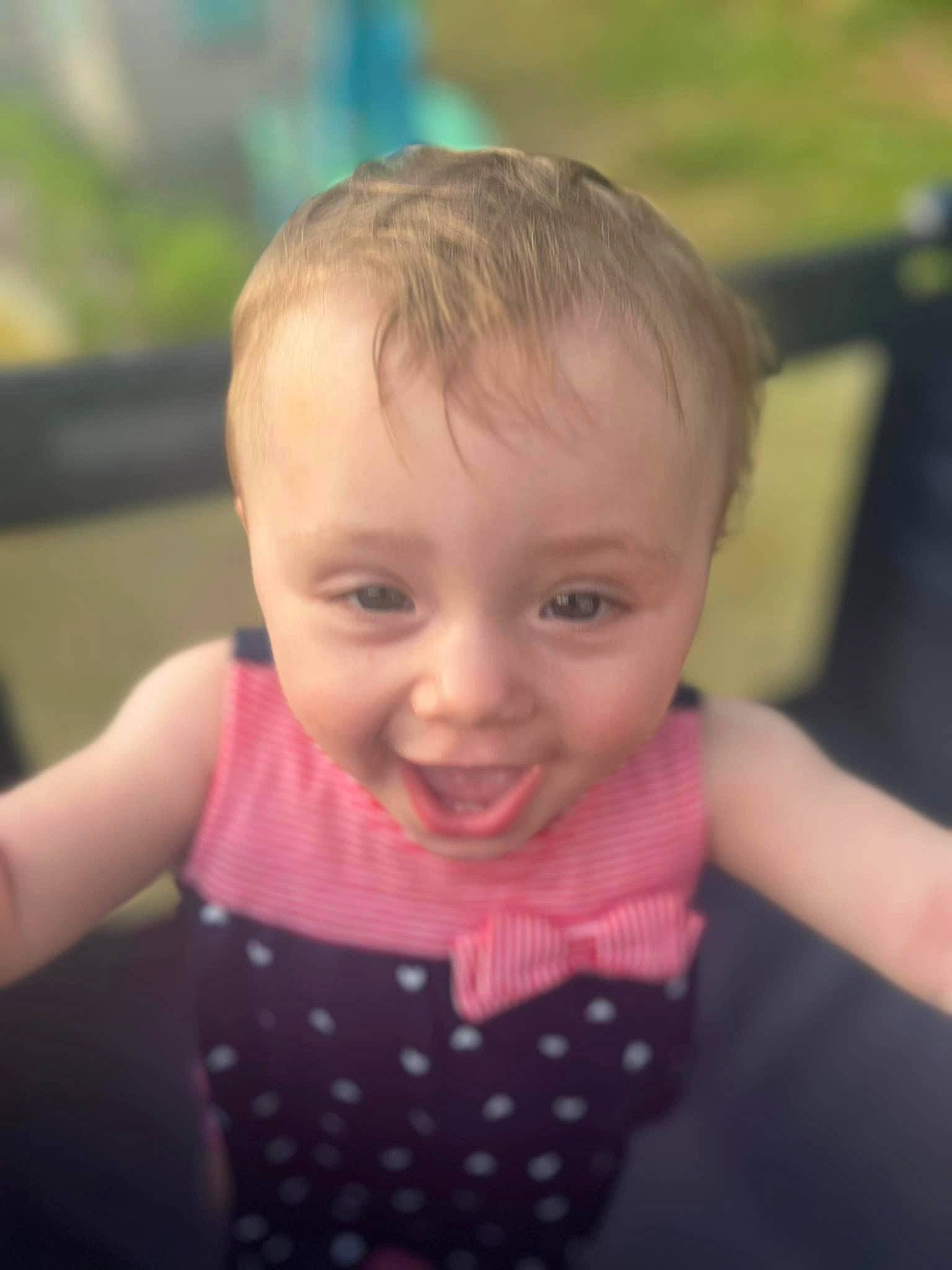 Zendaya is registered to the contest to win money with this photo: baby_toddler_clothing, cheek, child, eyelash, facial_expression, fun, grass, hair, hairstyle, happy, iris, laugh, leisure, lip, nose, person, recreation, sitting, skin, smile