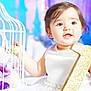 baby, child, girl, white_dress, pearls, glitter, number_one, flower, purple_flower, birdcage, decor, portrait, smiling, happy, celebration, indoor, cute, face, hands, bright