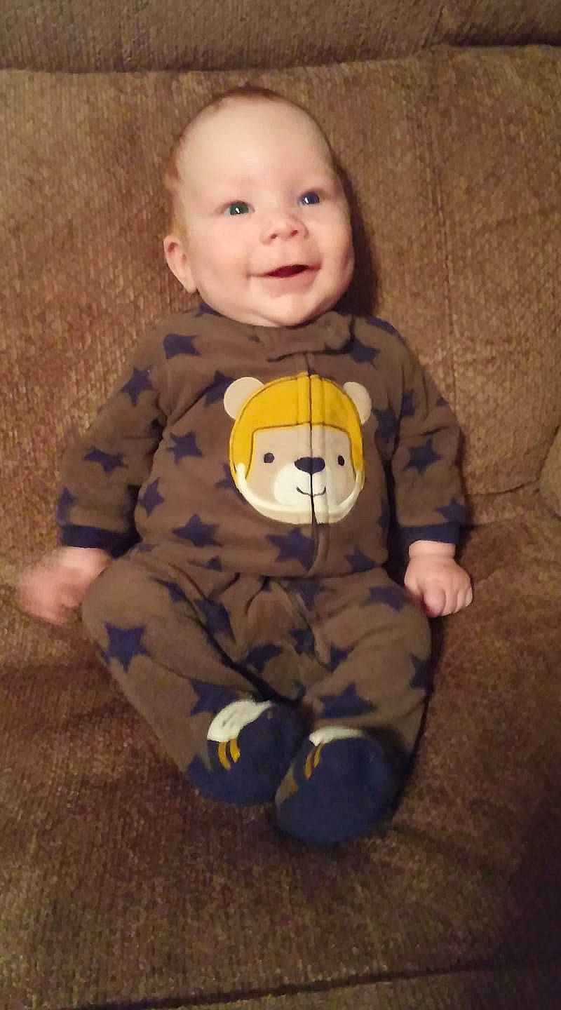 Evan is registered to the contest to win money with this photo: baby, baby_toddler_clothing, cheek, child, person, sleeve, smile, toddler, toy