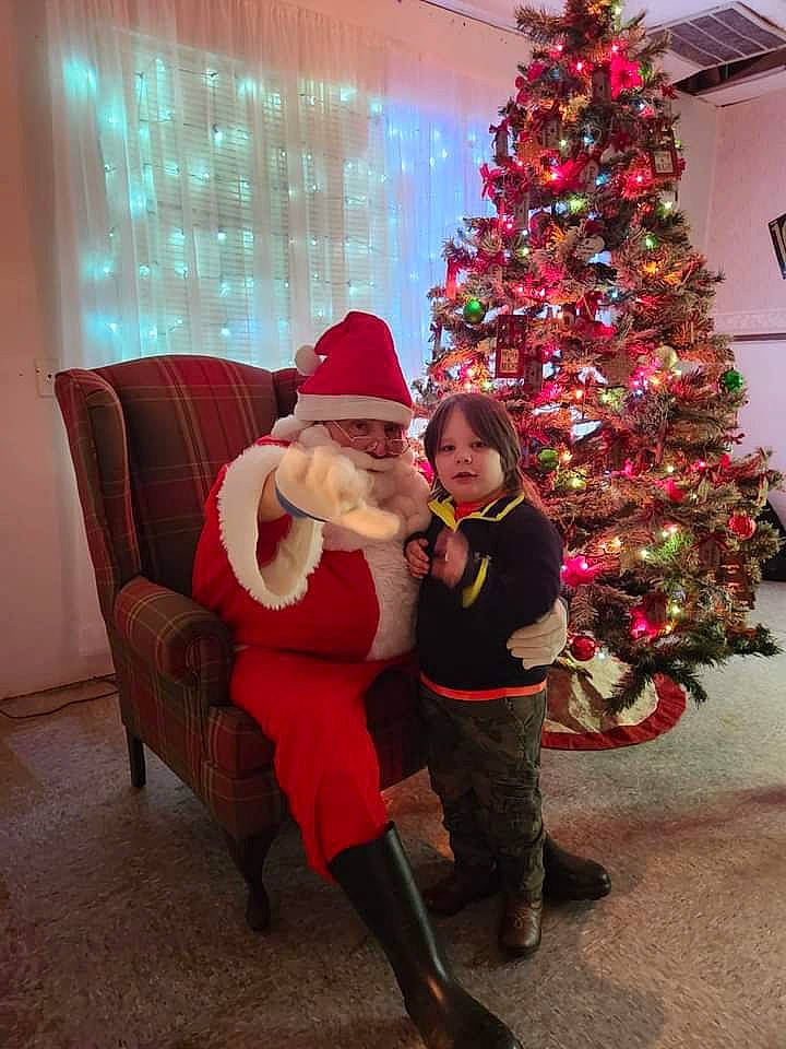 Evan joined the competition — help win amazing prizes! christmas, christmas_decoration, christmas_eve, christmas_ornament, christmas_tree, comfort, conifer, costume_hat, event, evergreen, fun, happy, hat, headwear, holiday, holiday_ornament, lap, lighting, magenta, ornament