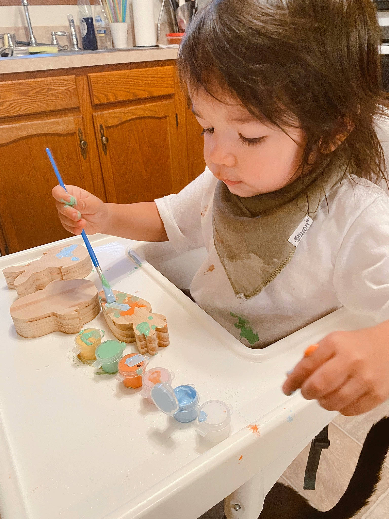 Koa joined the competition — help win amazing prizes! cabinetry, chair, chest_of_drawers, child, cooking, cupboard, drawer, engineering, fun, hand, learning, nail, paint, party_supply, person, play, room, science, table, tableware