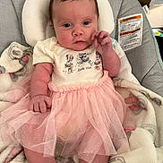 Aurora joined the competition — help win amazing prizes! baby, baby_seat, blanket, cartoon_characters, child, clothing, comfortable, curious, cute, cute_outfit, face, hand, indoor, infant, looking, pink, portrait, soft, tutu, white