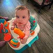 Aurora joined the competition — help win amazing prizes! baby, blue_eyes, cheesy_puff, child, colorful, crib, curious, flooring, food, furniture, home, indoor, infant, person, pink_clothing, playtime, snack, toy, walker, young_child