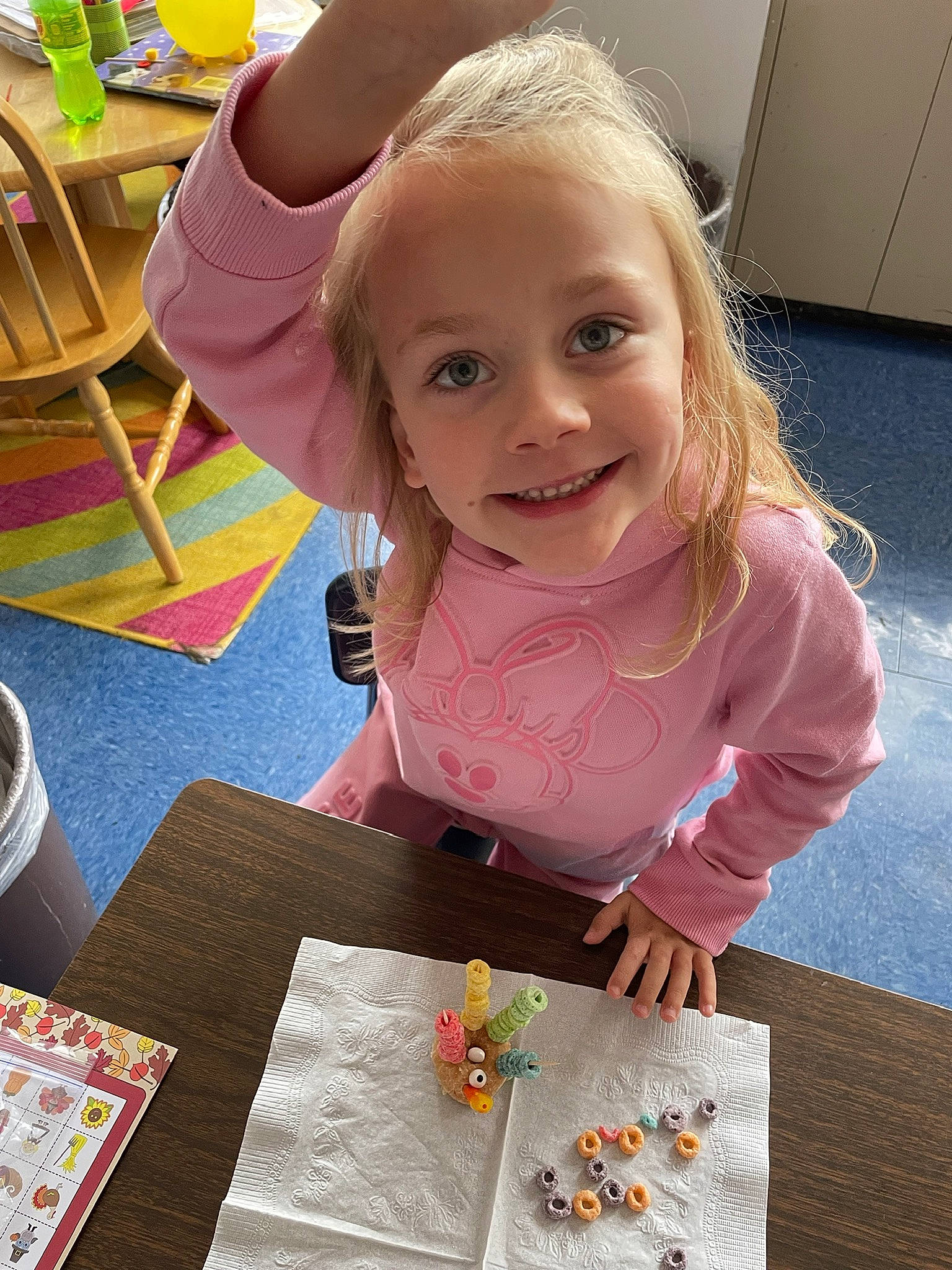 Ember is registered to the contest to win money with this photo: art, artist, baby_toddler_clothing, chair, child, flooring, fun, hair, happy, joy, kindergarten, paint, pattern, person, play, room, smile, table, toddler, visual_arts