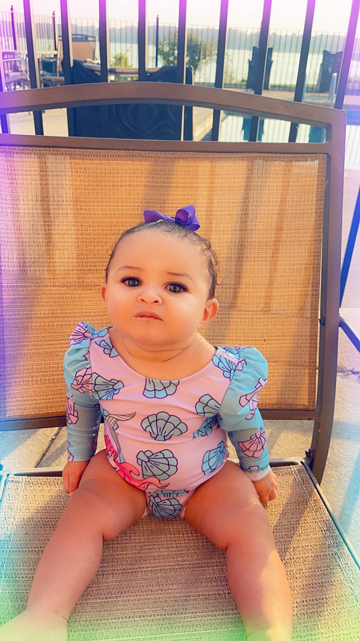 Layla is registered to the contest to win money with this photo: baby, baby_toddler_clothing, cheek, chest, child, flooring, fun, happy, human_leg, jewellery, leisure, pattern, person, sitting, skin, thigh, toddler