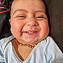 Adrien a rejoint le concours — aidez-le/la à gagner de superbes lots ! baby, background, blue_shirt, chubby_cheeks, closeup, clothing, cute, expression, face, happy, head, indoors, infant, necklace, person, portrait, skin, smiling, teeth, young_child