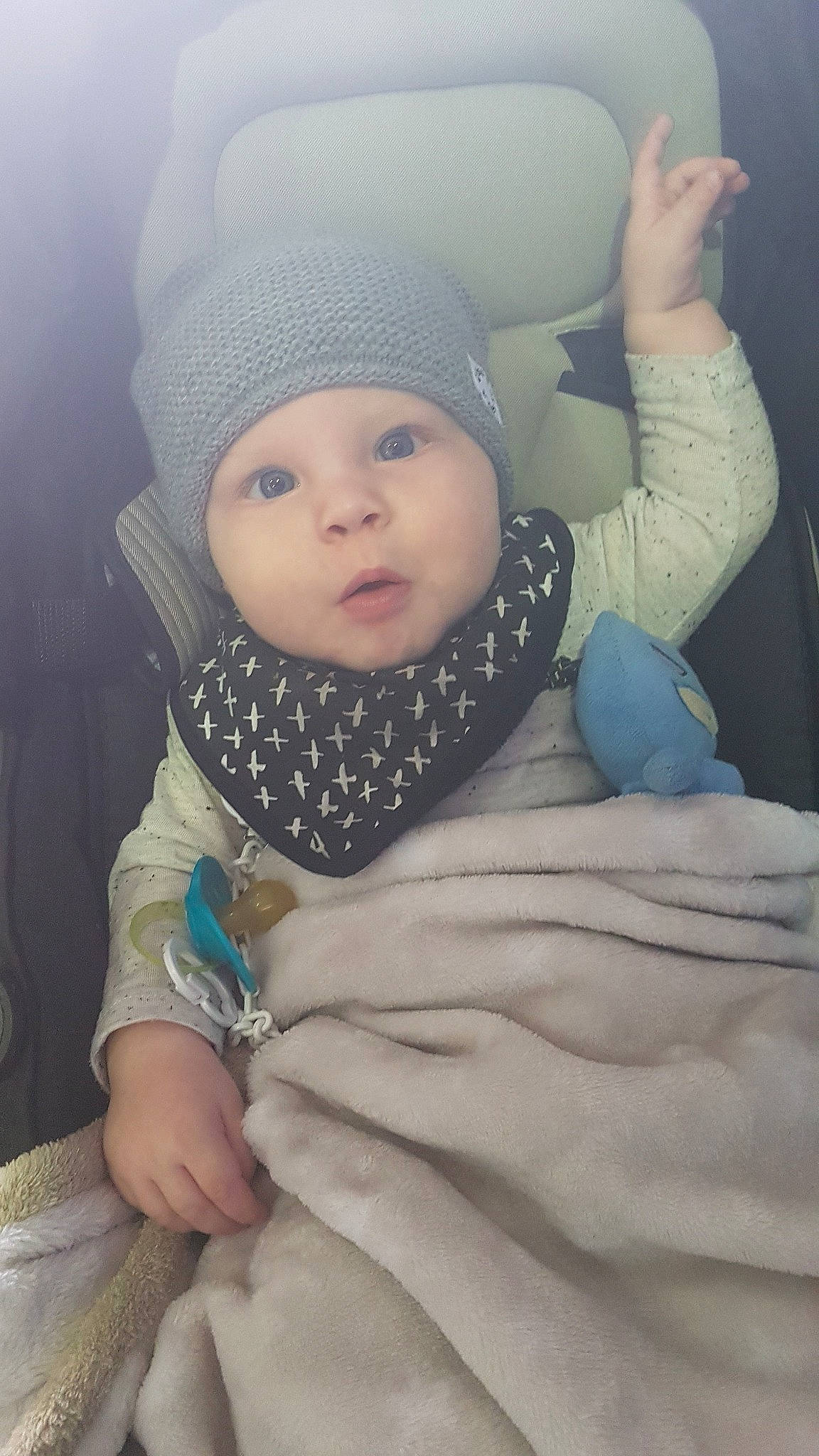 Kiah is registered to the contest to win money with this photo: baby, bonnet, cheek, child, cool, eye, face, finger, hand, head, headgear, knit_cap, person, skin, smile, toddler, winter