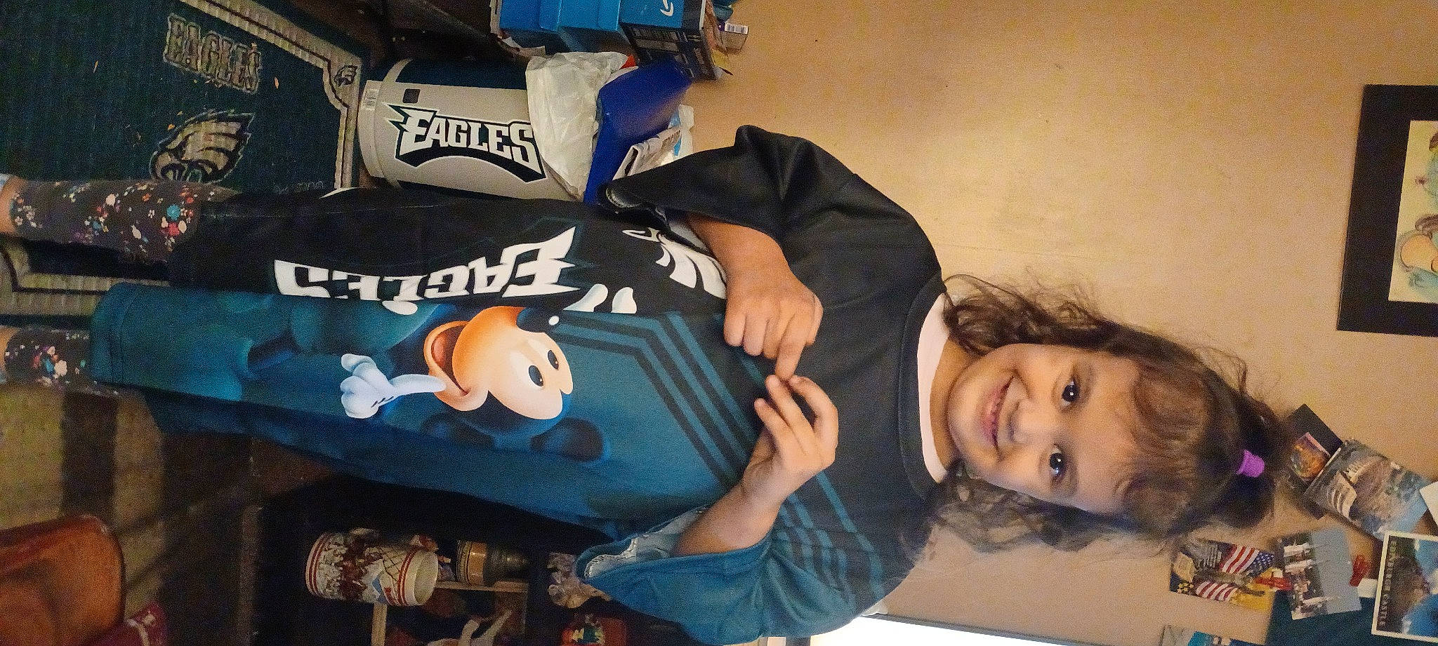 Lavinia is registered to the contest to win money with this photo: carmine, comfort, font, happy, joy, person, personal_protective_equipment, room, smile, sportswear, t_shirt, toy