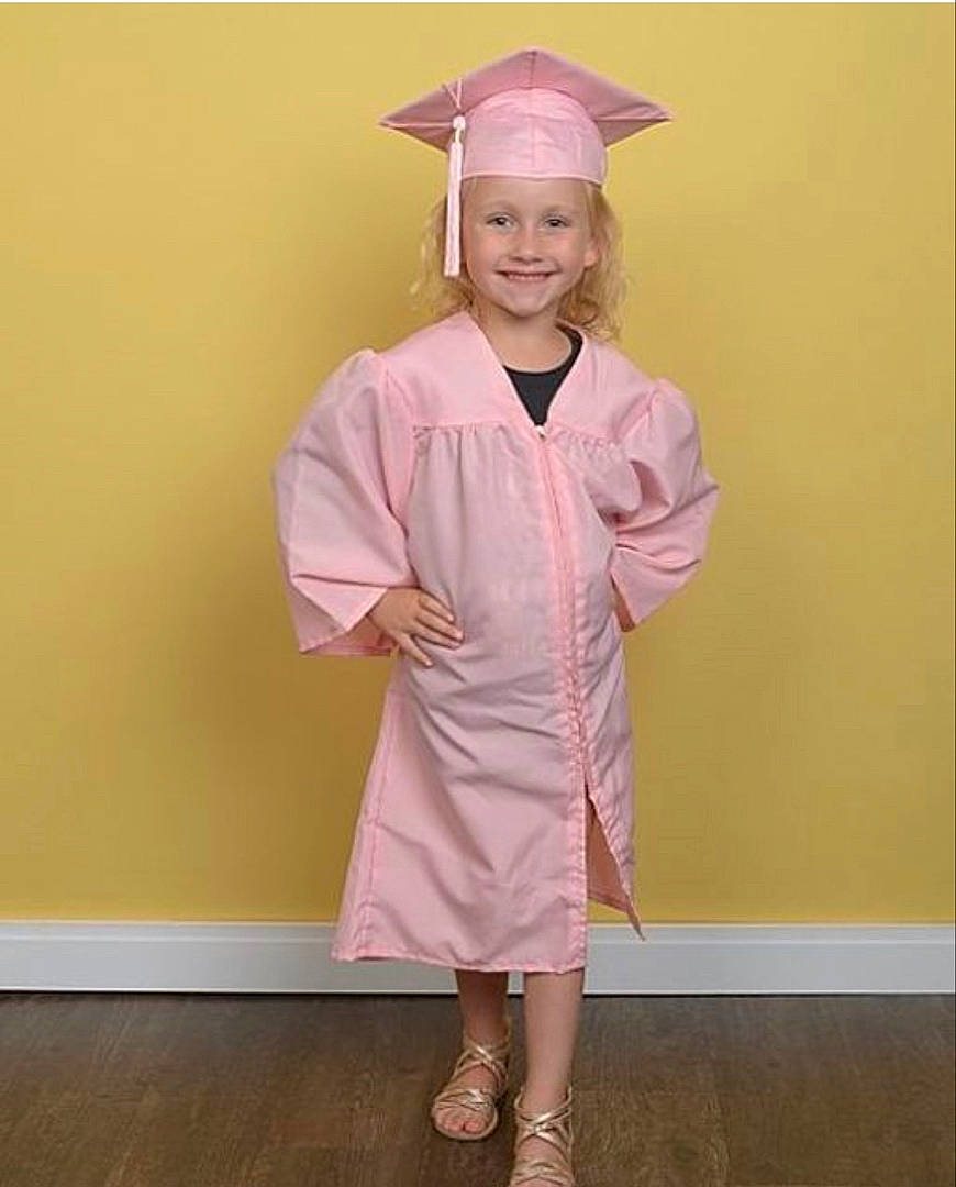 Quinn joined the competition — help win amazing prizes! academic_dress, academic_institution, arm, collar, event, eye, fashion_design, footwear, gesture, happy, hat, headgear, headwear, human_body, joy, mortarboard, outerwear, person, scholar, shoe