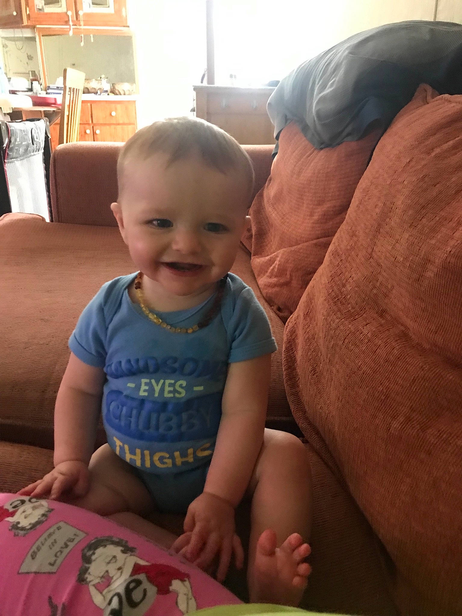 Anthony is registered to the contest to win money with this photo: baby, cheek, child, face, head, joy, mouth, person, sitting, skin, smile, toddler