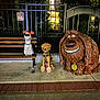 dog, poodle, statue, bench, night, outdoor, fence, cartoon, animation, concrete, leaves, lighting, smile, collar, tag, sidewalk, urban, art, park, pets