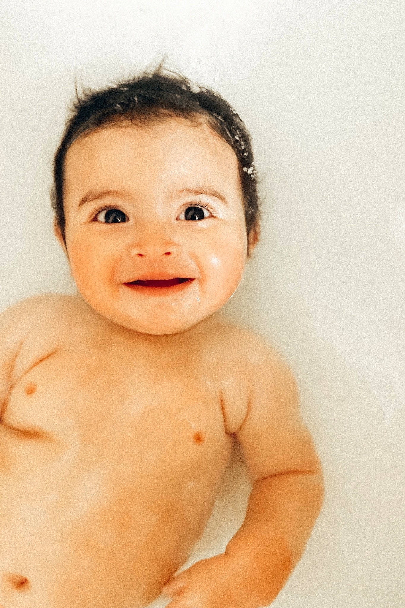 Huxley is registered to the contest to win money with this photo: arm, cheek, ear, eye, eyebrow, eyelash, face, gesture, hand, happy, head, human_body, iris, jaw, joy, lip, neck, nose, person, skin