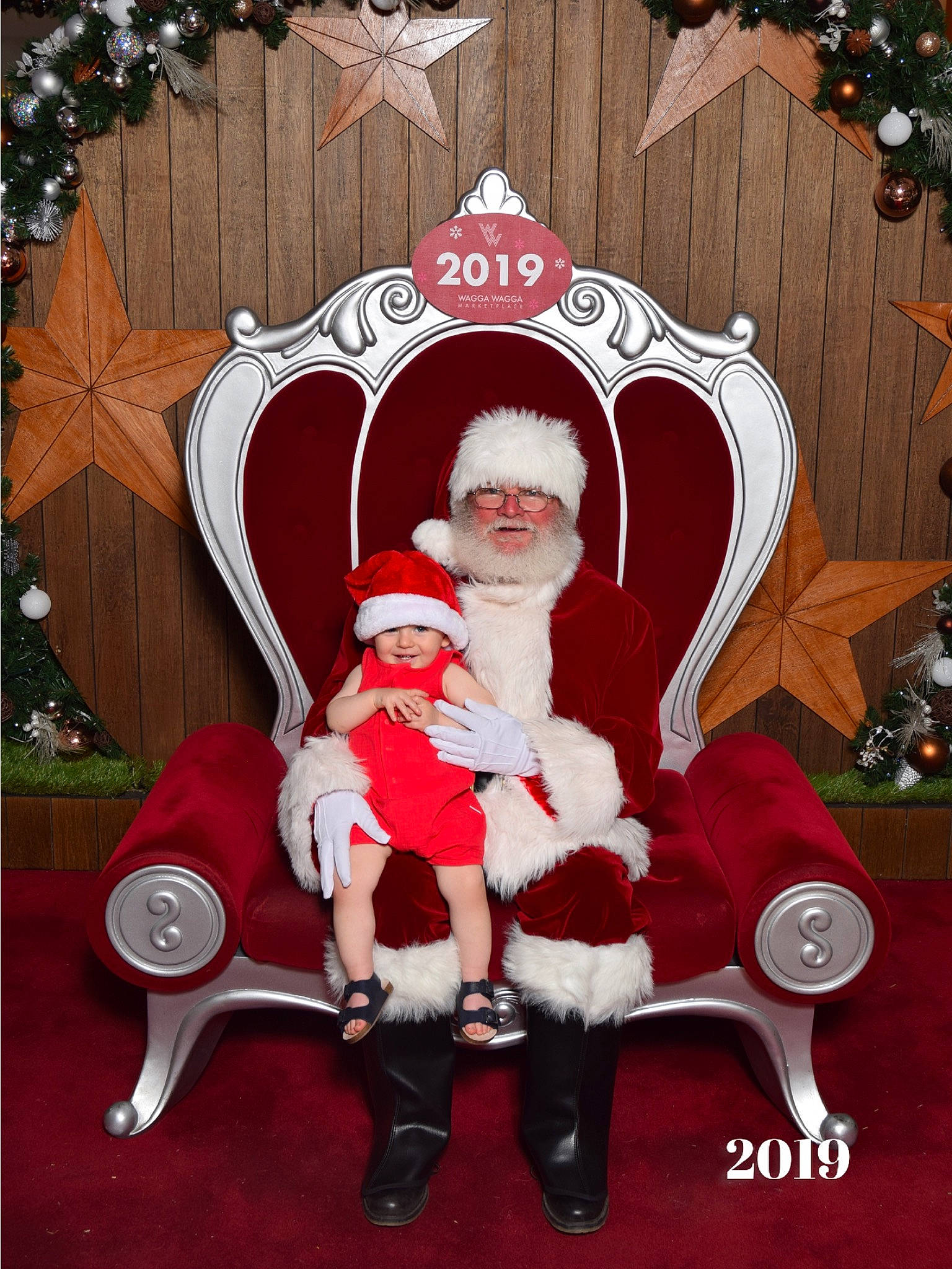 Gabe joined the competition — help win amazing prizes! chair, christmas, christmas_eve, christmas_ornament, fictional_character, furniture, headwear, holiday, holiday_ornament, human_body, joy, lap, person, red, santa_claus