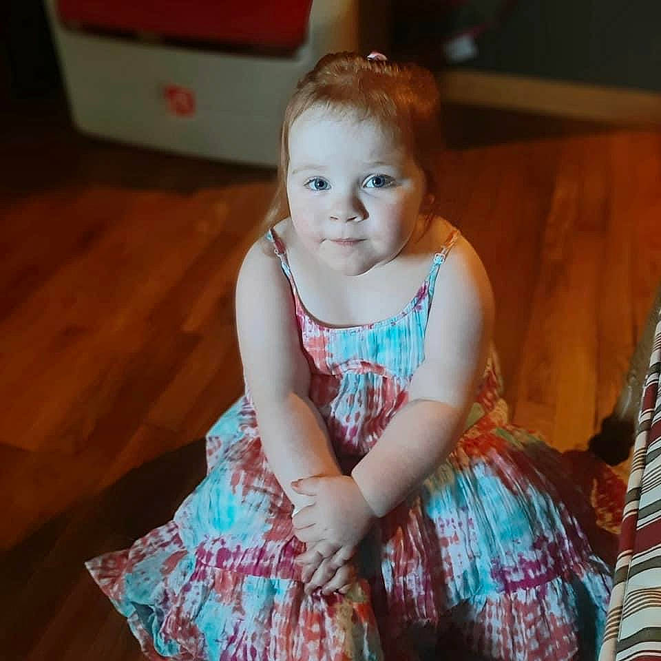 Ella joined the competition — help win amazing prizes! baby_toddler_clothing, cheek, chin, day_dress, dress, eye, face, flash_photography, flooring, hair, happy, head, iris, neck, one_piece_garment, person, skin, sleeve, smile, toddler