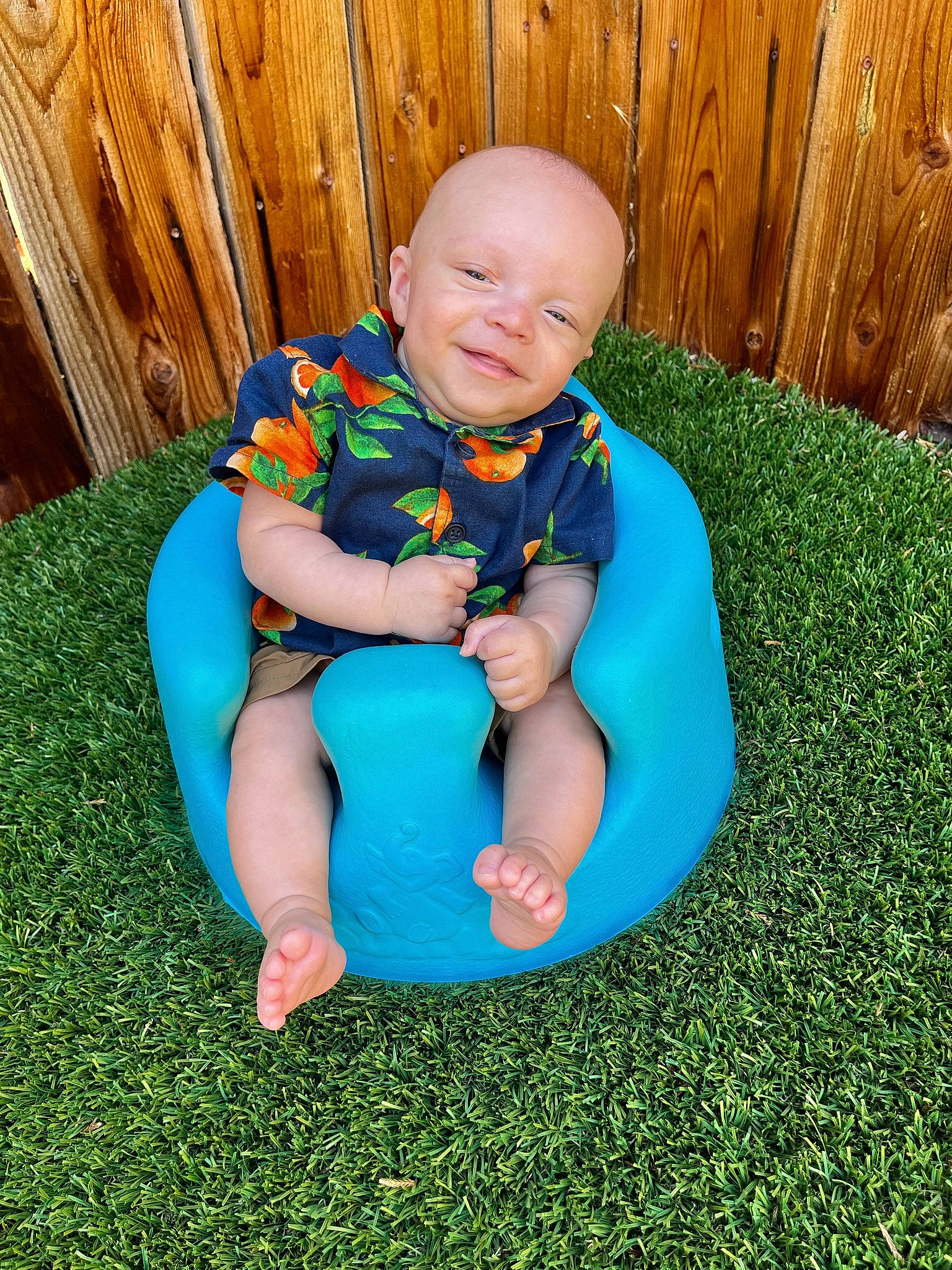 Oskar Wolf is registered to the contest to win money with this photo: baby, baby_toddler_clothing, barefoot, child, electric_blue, eye, face, fun, grass, grass_family, happy, lawn, leisure, people_in_nature, person, plant, sitting, smile, t_shirt, thigh