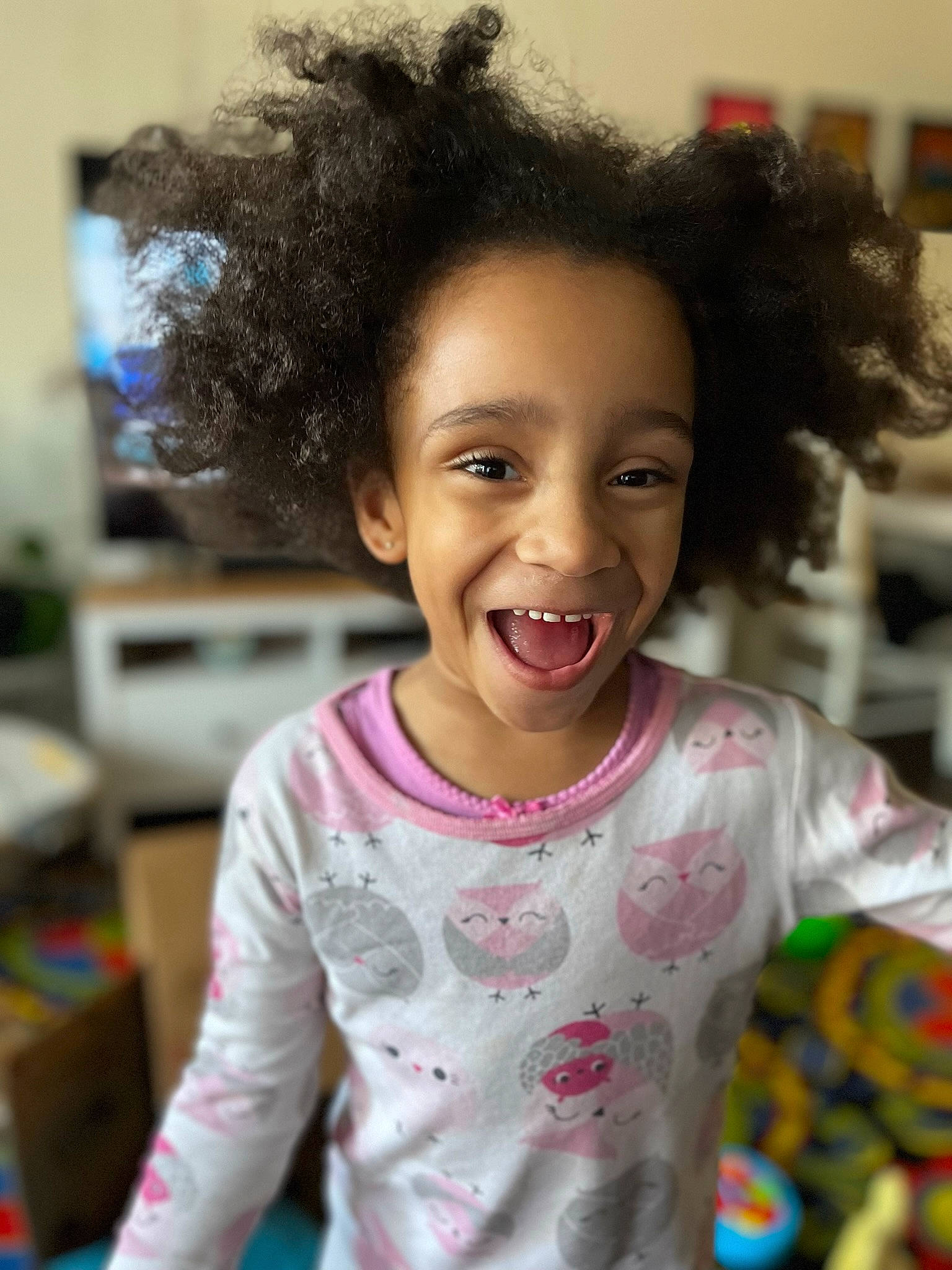 Jane Marie is registered to the contest to win money with this photo: baby_toddler_clothing, cheek, ear, eye, face, facial_expression, gesture, hair, hairstyle, happy, head, iris, mouth, nose, organ, person, pink, skin, sleeve, smile