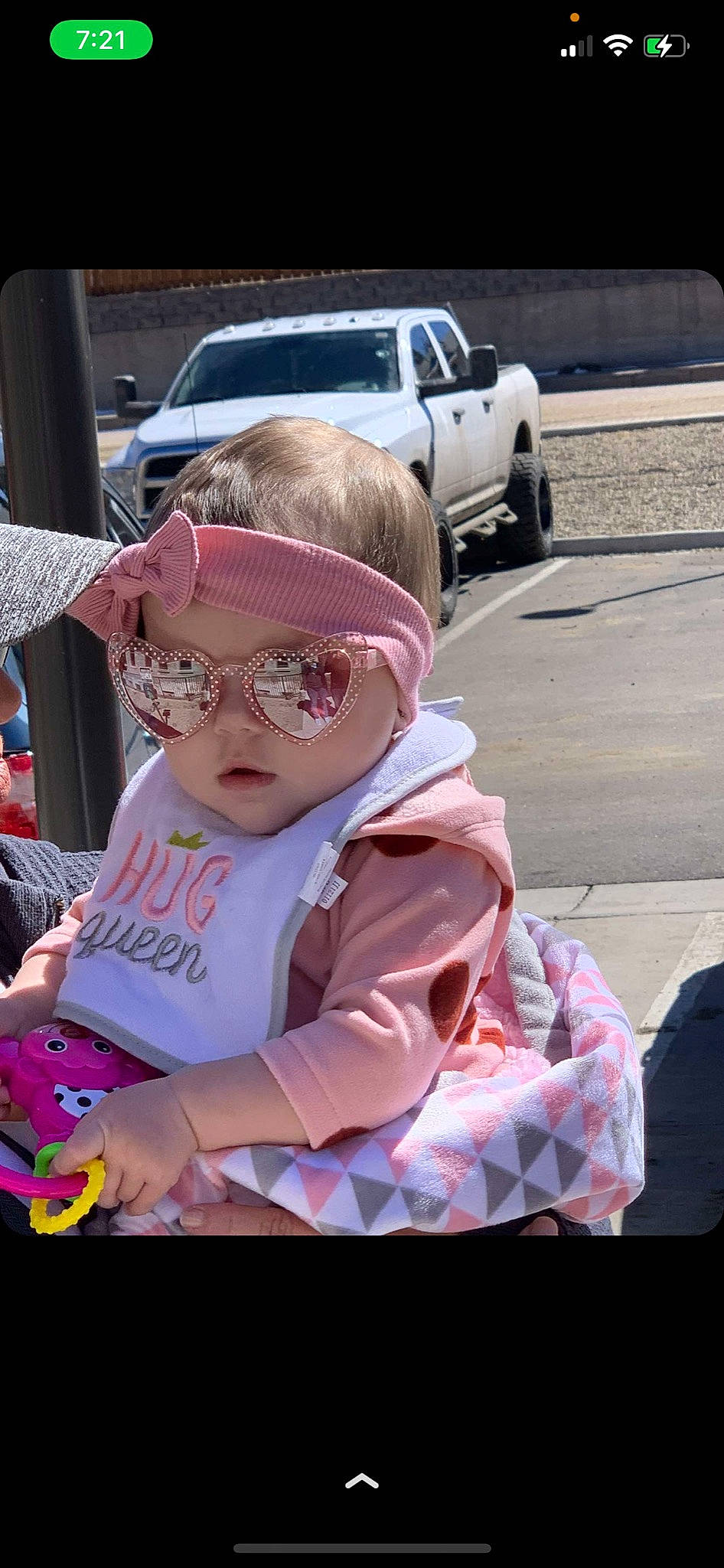 Jaylee is registered to the contest to win money with this photo: asphalt, automotive_design, automotive_exterior, automotive_tire, car, event, eyewear, fun, glasses, goggles, hand, motor_vehicle, person, personal_protective_equipment, pink, sunglasses, tire, toddler, vehicle_door, vision_care