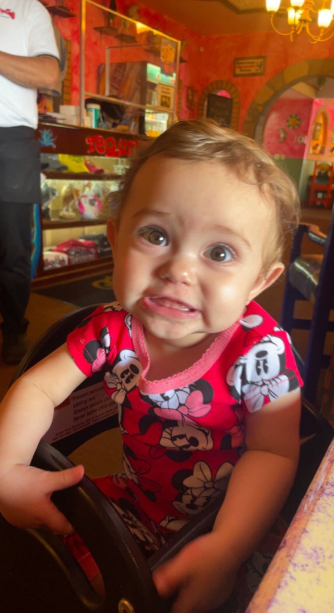 Jaylee is registered to the contest to win money with this photo: baby, baby_toddler_clothing, blond, chair, cheek, child, chin, eye, facial_expression, fun, iris, mouth, nose, person, product, shelf, skin, smile, standing, t_shirt