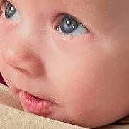 Caz is registered to the contest to win money with this photo: baby, face, close_up, blue_eyes, infant, child, skin, portrait, social_media, comment_section, likes, profile_picture, text, digital, screenshot, mobile_screen, expression, cute, young, human