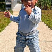 Saint joined the competition — help win amazing prizes! toddler, child, barefoot, jeans, long_sleeve_shirt, smiling, outdoor, daylight, pathway, pond, grass, trees, wooden_dock, nature, playful, cute, person, standing, happy, greenery