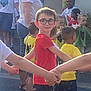 child, children, outdoor, holding_hands, group, boy, glasses, red_shirt, yellow_shirt, green_shirt, white_shirt, people, play, smile, friendship, casual_clothing, summer, daylight, social, fun