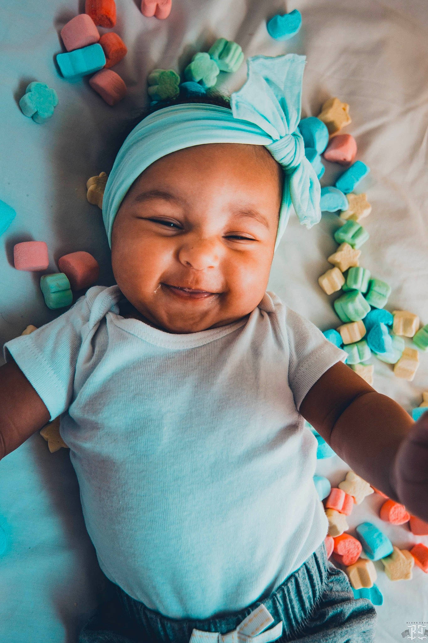 Cordelia is registered to the contest to win money with this photo: baby, baby_toddler_clothing, blue, cheek, child, cool, fashion_accessory, hair_accessory, happy, head, headgear, headwear, person, photography, skin, smile, toddler, turquoise