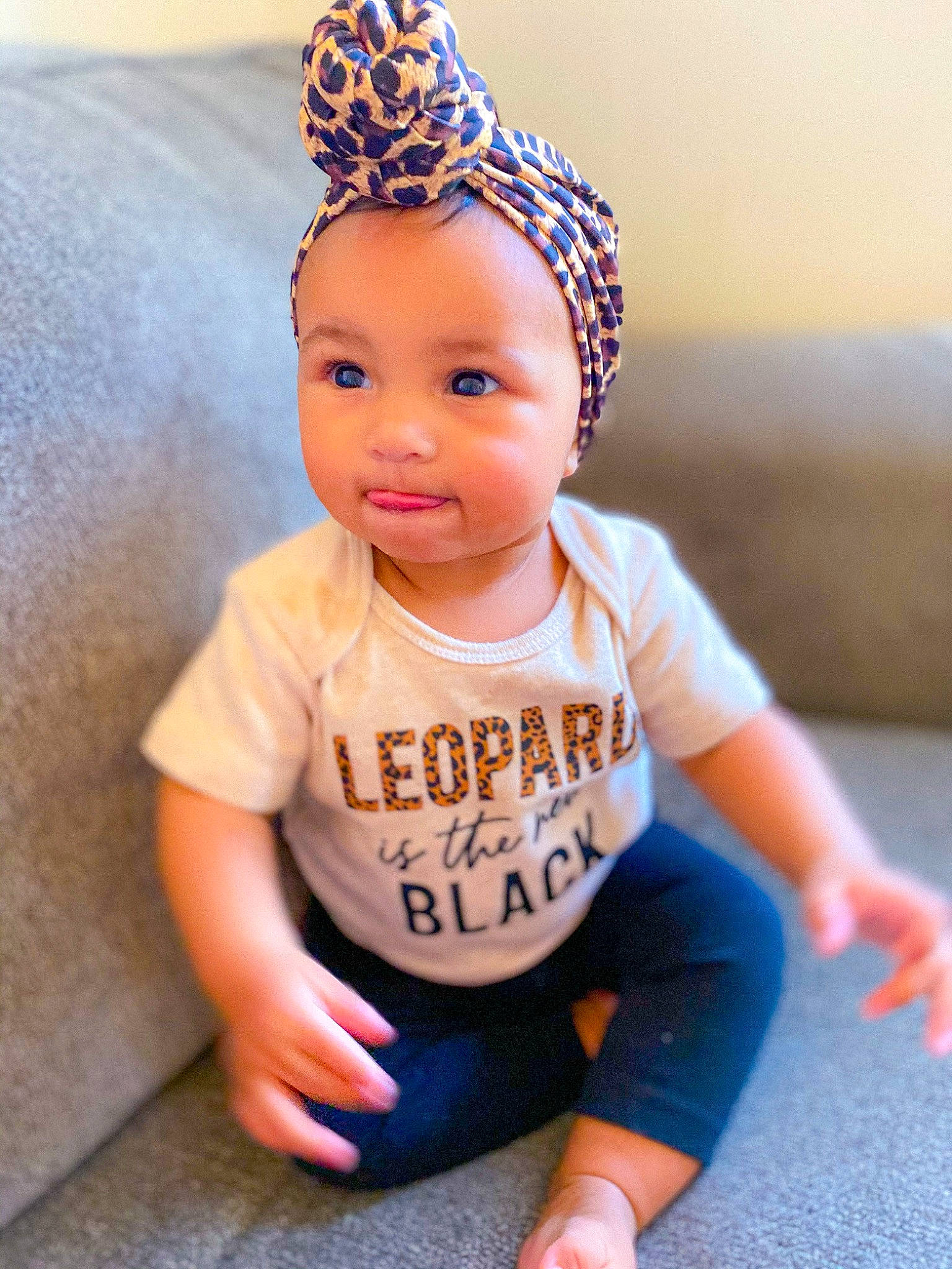 Cordelia is registered to the contest to win money with this photo: baby, baby_products, baby_toddler_clothing, beanie, blue, cap, child, clothing, cool, hair_accessory, head, headband, headgear, person, photography, product, skin, smile, t_shirt, toddler