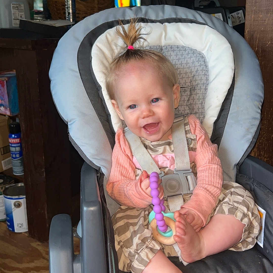 Savannah is registered to the contest to win money with this photo: baby, car, car_interior, carseat, chair, clothing, crib, cushion, face, furniture, hat, head, homedecor, infantbed, person, photography, portrait, transportation, vehicle, wood