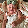 Alena joined the competition — help win amazing prizes! baby, smiling, bow, headwear, dress, floral_pattern, blanket, teddy_bear_print, infant, happy, cute, child, portrait, skin, face, arms, lying_down, indoors, soft_texture, person