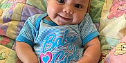 Alena joined the competition — help win amazing prizes! baby, infant, smiling, cute, onesie, blue_clothing, striped_clothing, face, child, happy, lying_down, quilt, blanket, colorful, animal_pattern, indoors, skin, person, young_child, cheerful
