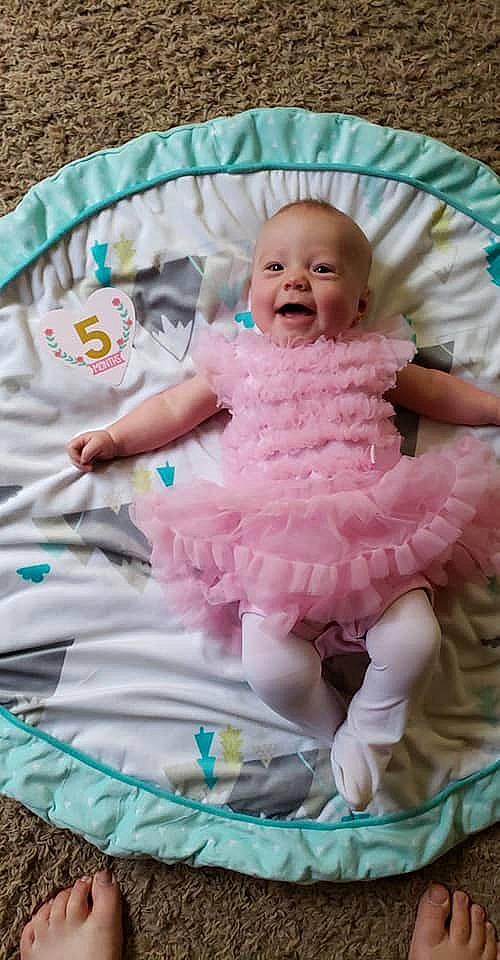 Tayden joined the competition — help win amazing prizes! baby, baby_products, baby_toddler_clothing, child, infant_bed, linens, person, pink, product, textile, toddler, turquoise