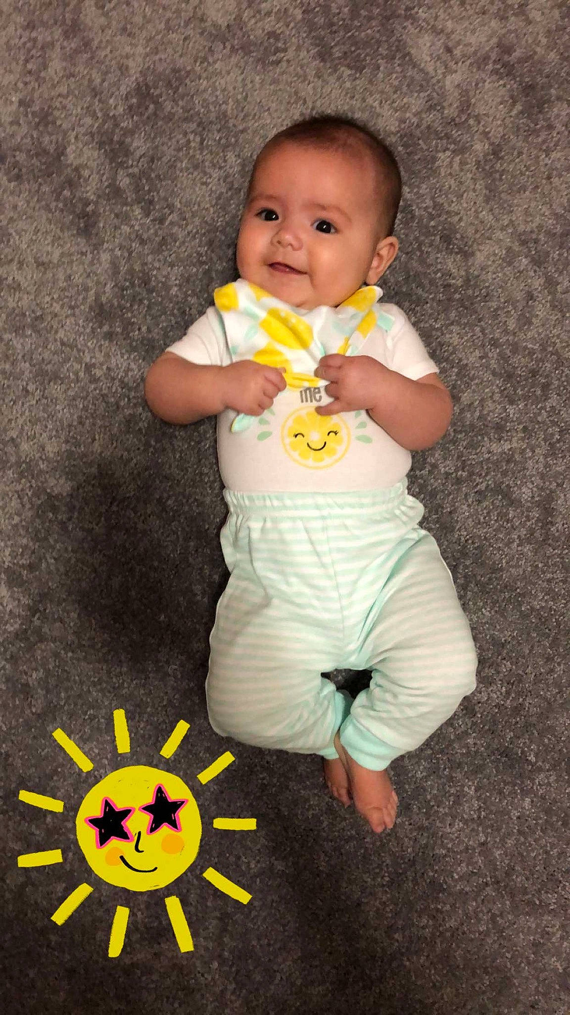 Toula is registered to the contest to win money with this photo: baby, baby_products, baby_toddler_clothing, child, person, play, product, sitting, skin, smile, toddler, yellow