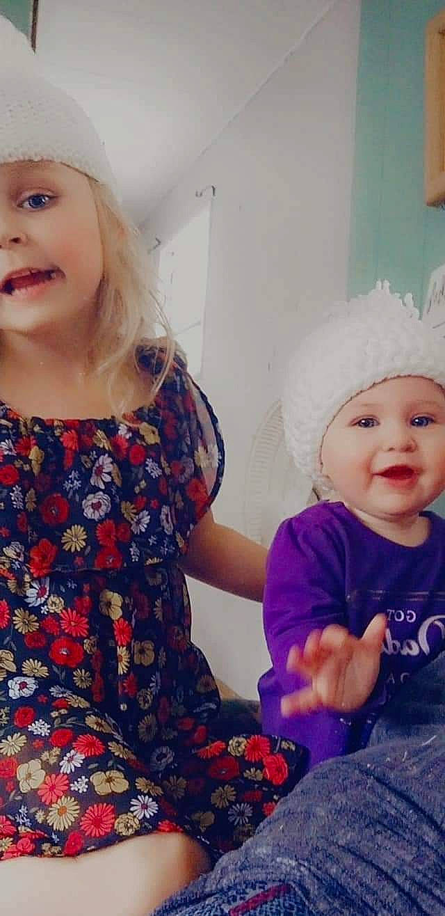 Violet is registered to the contest to win money with this photo: arm, baby, baby_toddler_clothing, cap, child, clothing, cool, eye, face, happy, headgear, headwear, human_body, iris, outerwear, pattern, person, skin, sleeve, smile