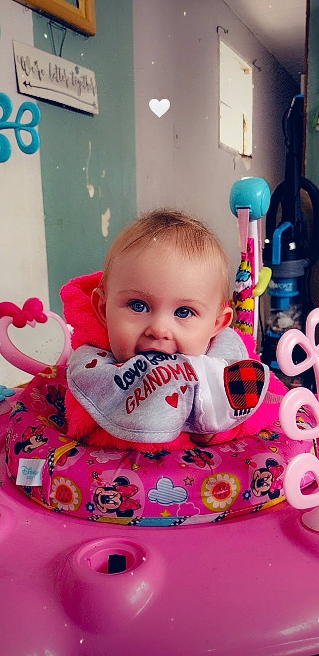 Violet is registered to the contest to win money with this photo: baby, baby_products, baby_toddler_clothing, carmine, cheek, child, design, drinkware, eyelash, fun, happy, magenta, person, pink, play, room, stuffed_toy, sweetness, toddler, toy