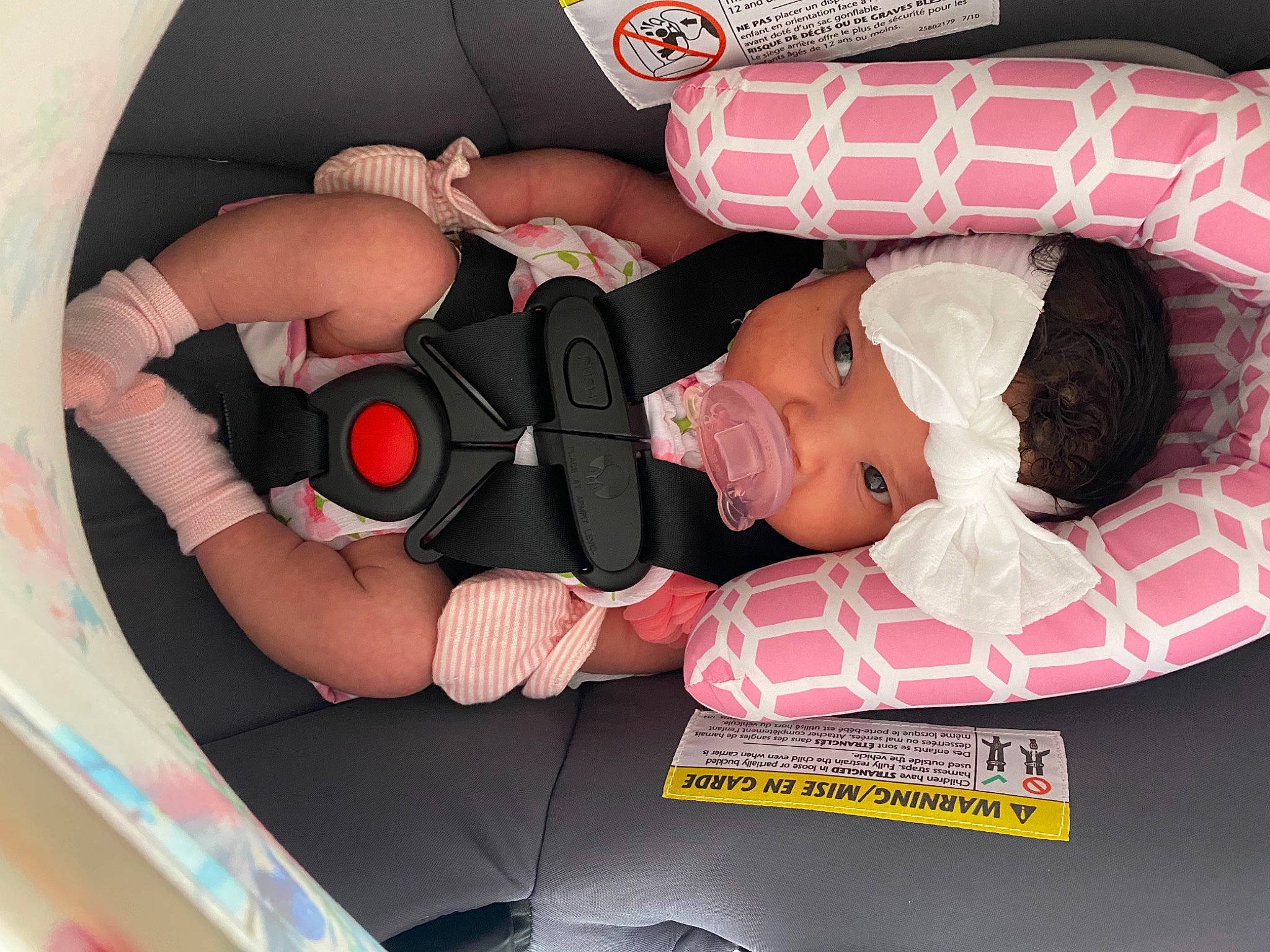 Kayloni is registered to the contest to win money with this photo: arm, auto_part, automotive_design, baby, baby_products, baby_toddler_clothing, car_seat, comfort, finger, hat, headwear, health_care, mouth, nail, person, pink, product, red, service, thigh