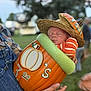baby, sleeping, pumpkin, hat, straw_hat, orange, striped_clothing, child, outdoor, person, overalls, hand, grass, fall, autumn, costume, cute, festival, holding, portrait
