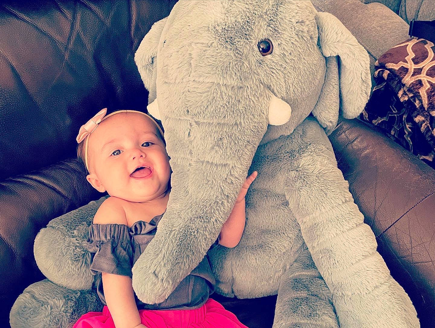 Kenslie is registered to the contest to win money with this photo: african_elephant, arm, baby, baby_toddler_clothing, child, comfort, cool, elephant, finger, flash_photography, fun, gesture, happy, hat, indian_elephant, mouth, person, skin, textile, toddler